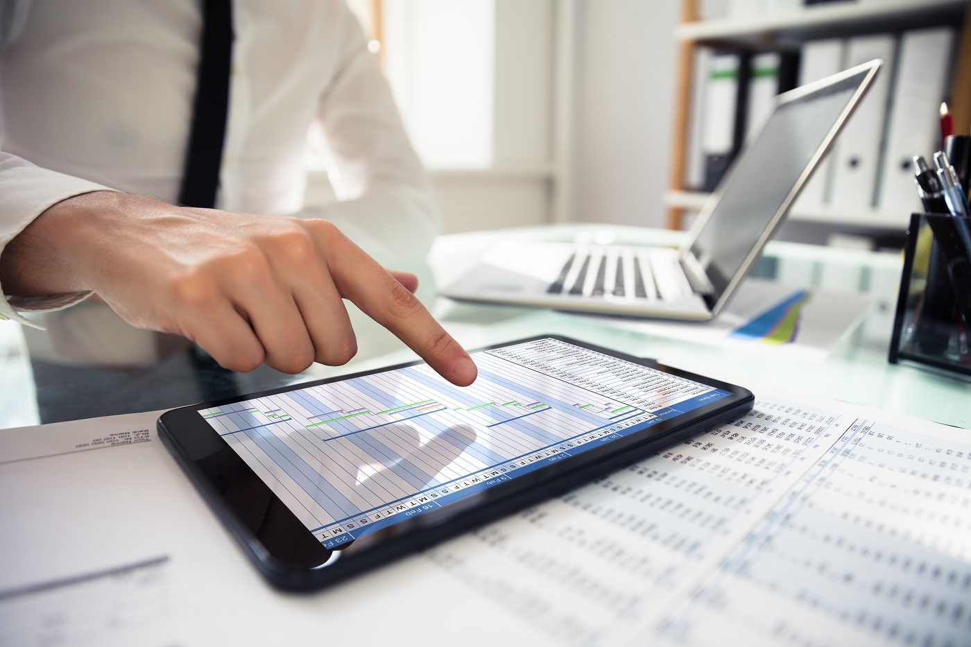 Businessperson Analyzing Gantt Chart On Digital Tablet